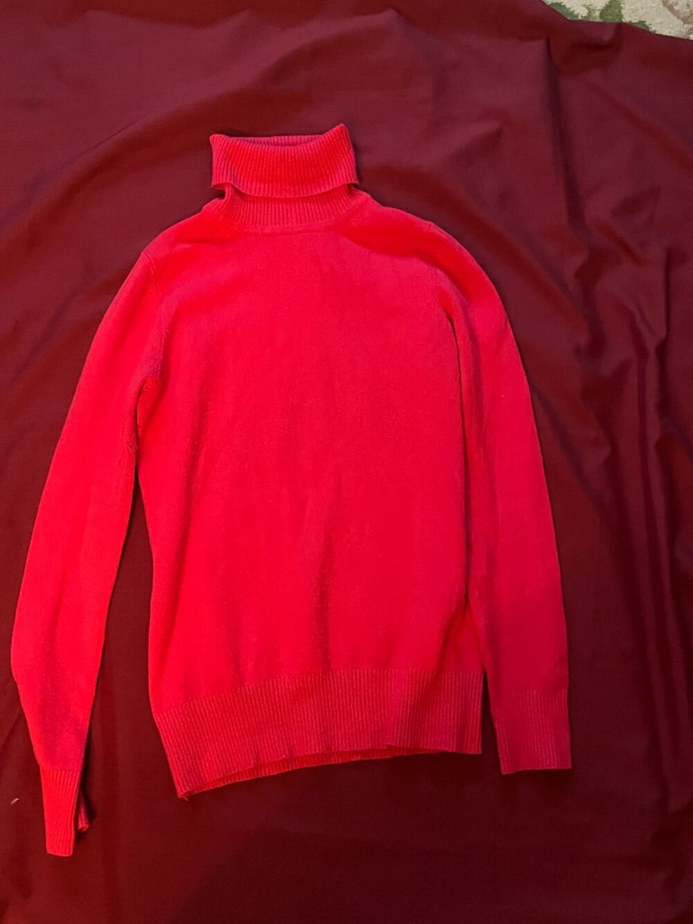 Fitted, fine-gauge knit turtleneck in a bright coral-red, for women in size M.